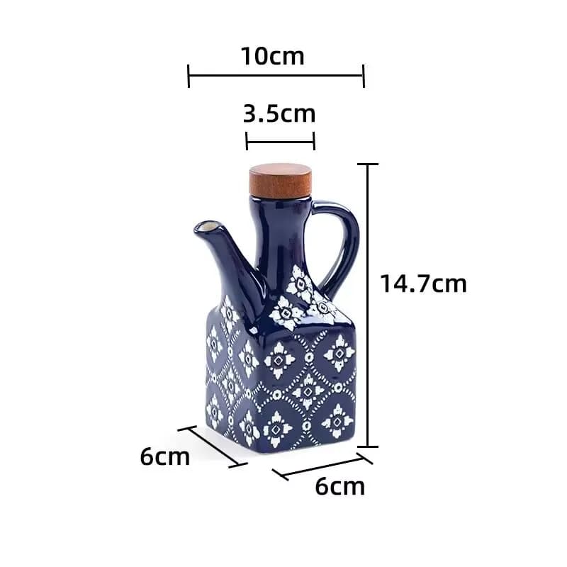 Ensemble de galettes en céramique avec bec verseur, bouteilles d'huile de cuisine et de verre en vin