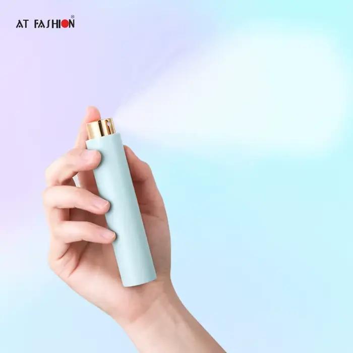 Mini atomiseur de parfum portable rotatif