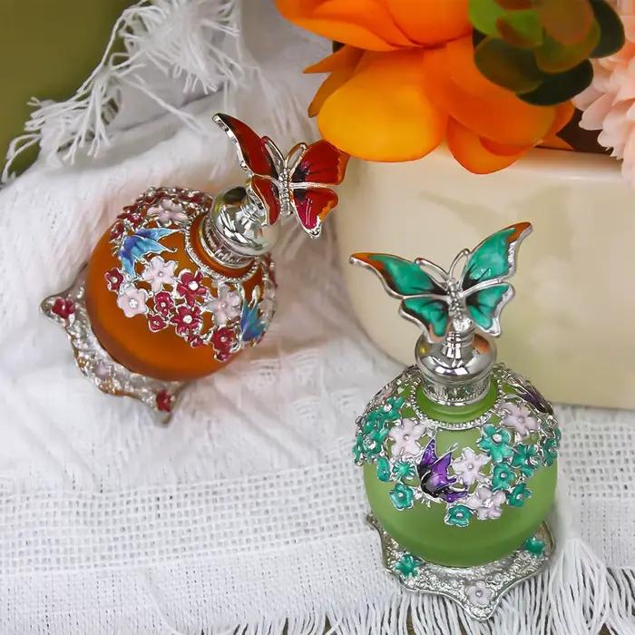 Flacon de parfum vintage avec contenant en verre givré émaillé métallique et capuchon créatif oiseau/papillon
